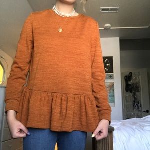 burnt orange peplum long sleeve top!
